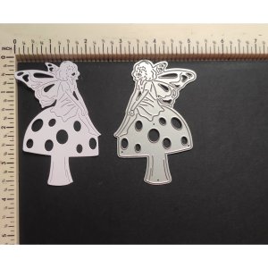 FAIRY SITTING ON MUSHROOM